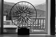 Grayscale Photo of Round Metallic Decoration