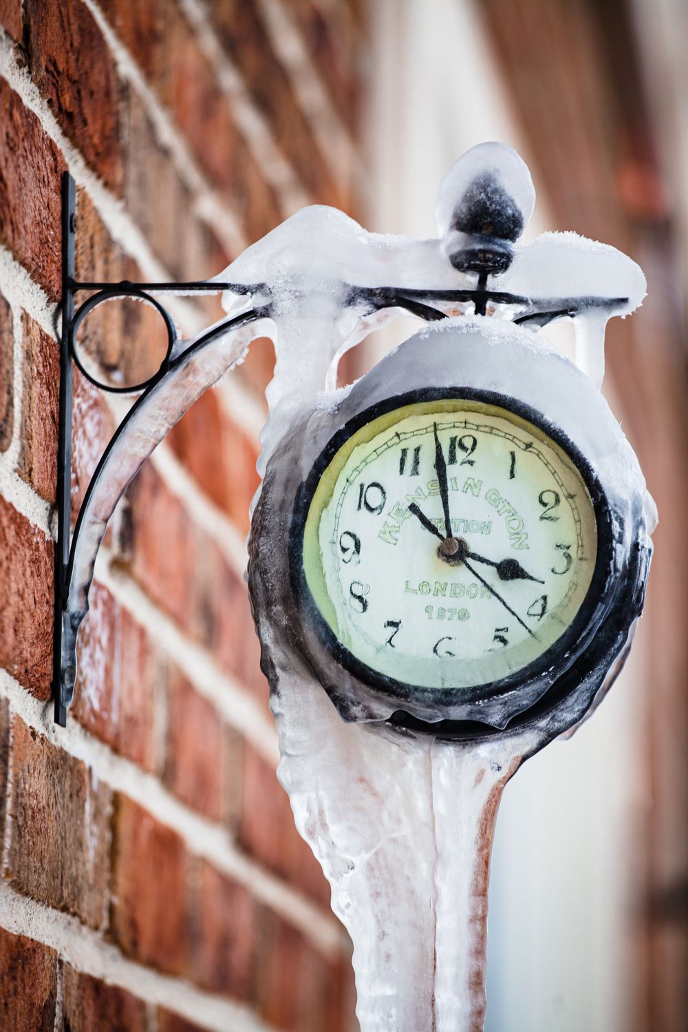 A Frozen Clock on a Brick Wall · Free Stock Photo