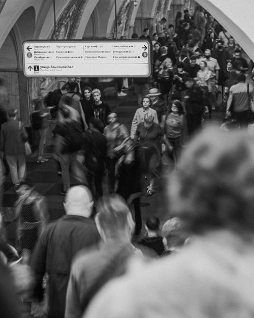 Free Dynamic crowd scene in a Moscow metro station captured in black and white, showcasing commuter life. Stock Photo