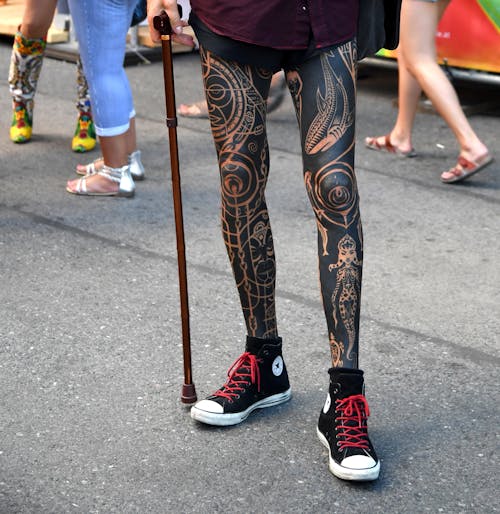 Person With Body Tattoo Wearing Black Shoes