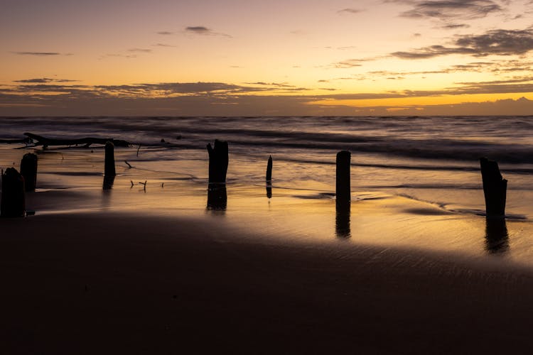 Sea At Sunset With Remains Of Old Pier