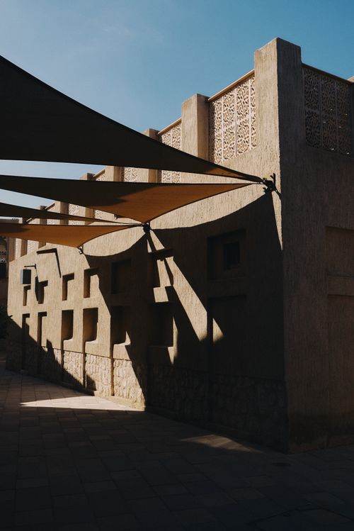 Free Sunlight and shadows in Dubai's traditional architecture highlight rich textures and design. Stock Photo