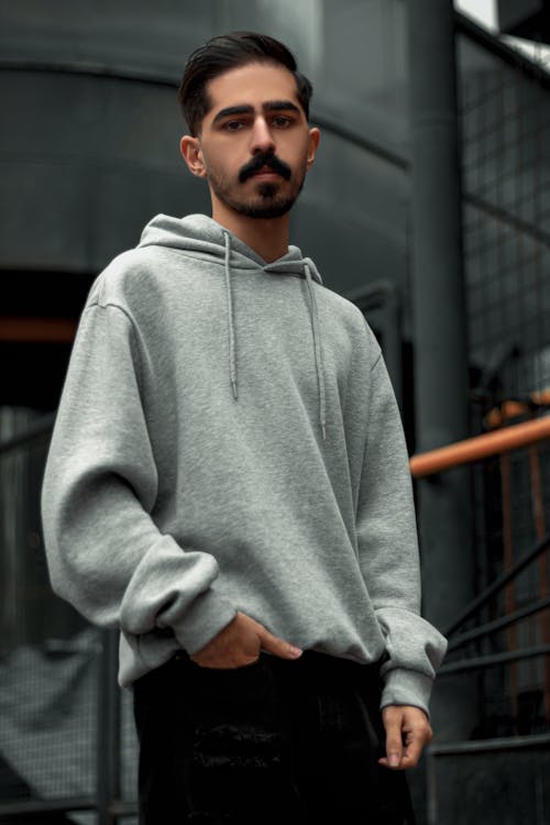 A Man in Gray Hoodie Standing