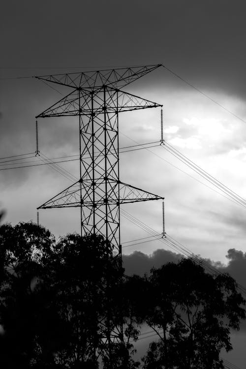 Grayscale Photo of Electric Tower