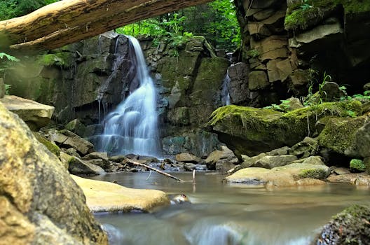 Scenic waterfall flowing over rocks in Slovak Paradise, offering a serene nature landscape.