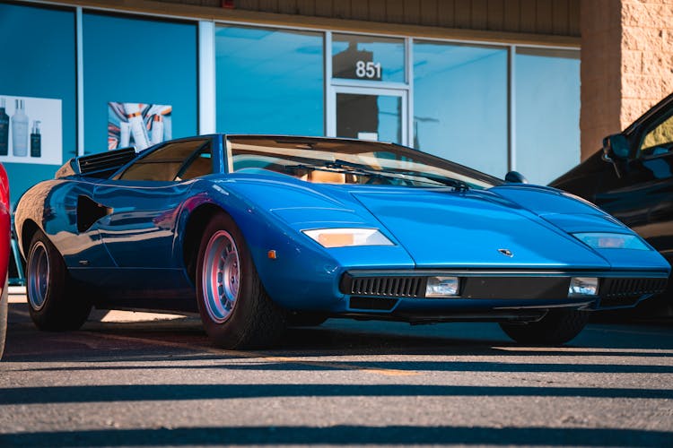 A Blue Car Parked On The Street