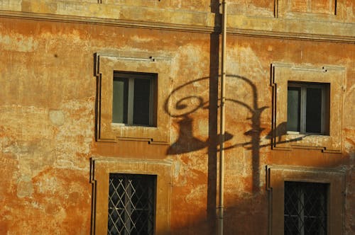 Photo of a Street Lamp Shadow on a Wall