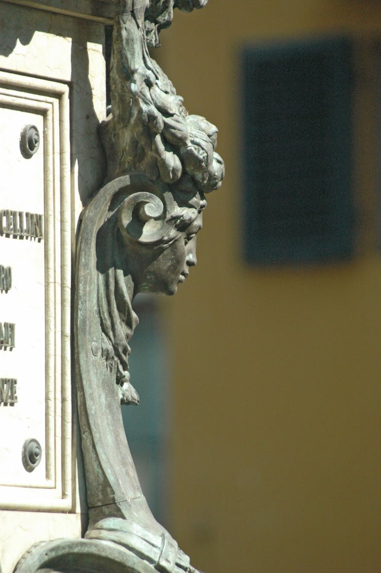 Metal Sculpute On A Statue 