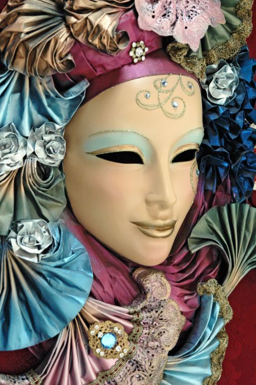 Free A detailed venetian mask featuring intricate designs and vibrant colors. Stock Photo
