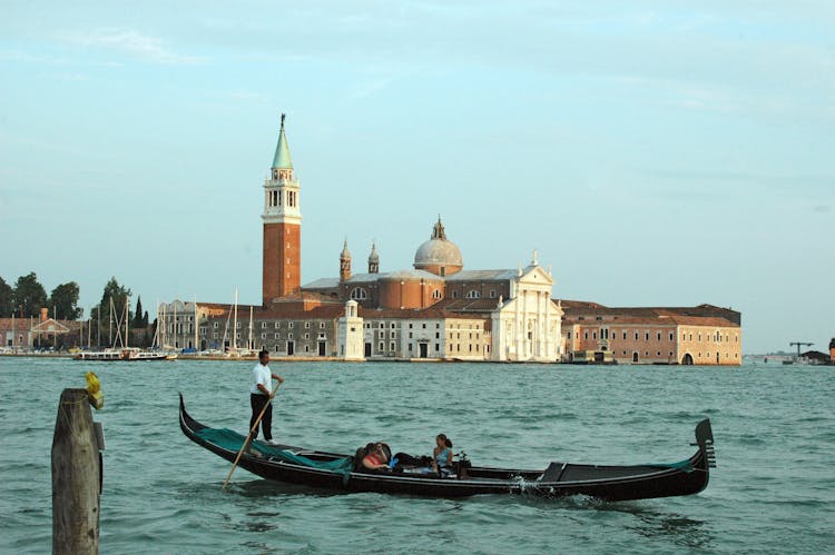 Channel With Basilica In Background In Venice Italy