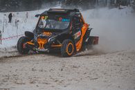 Orange and Black F 1 Car on Snow Covered Ground