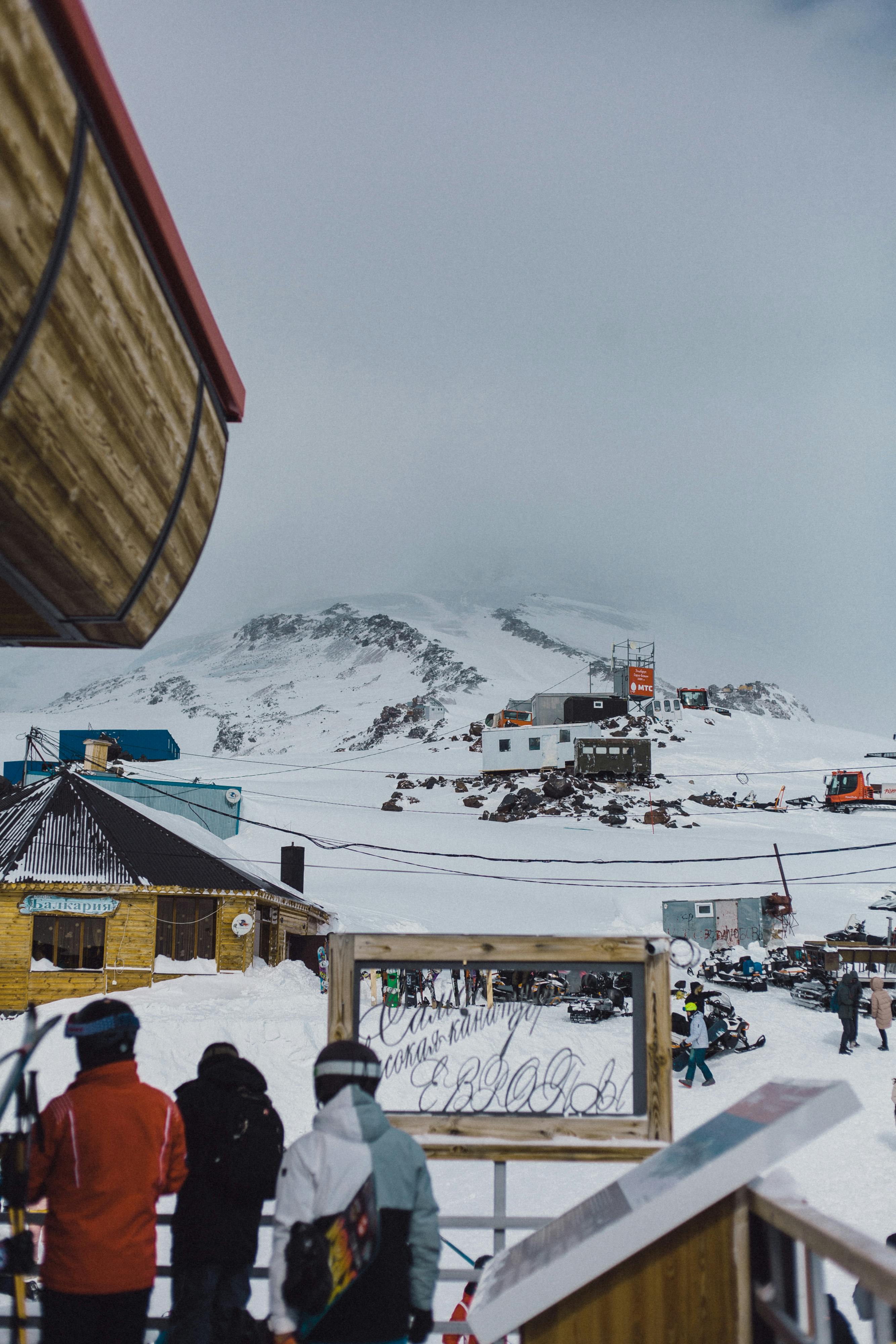 Prescription Goggle Inserts - Winter scene at a ski resort with tourists enjoying cold, snowy weather.