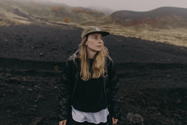 Woman Standing In Barren Field