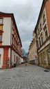 Paved Street Between Concrete Buildings