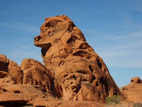 Free Majestic red rock formation under a clear blue sky in a desert landscape. Stock Photo