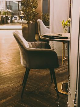 Armchair in a stylish cafe setting in Tyumen, Russia, showcasing modern interior design.