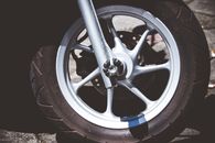 Silver Motorcycle Rim and Tire