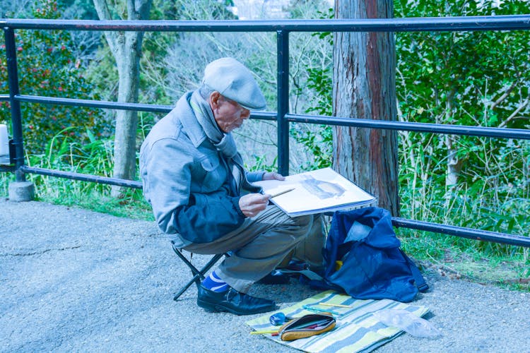 Elderly Man Doing Painting 