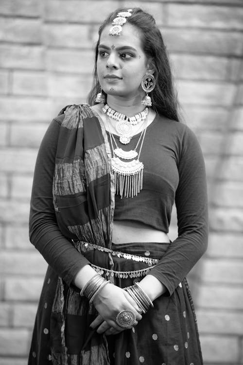 Grayscale Photo of a Woman in Traditional Clothing