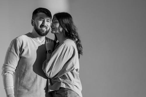 Free Man and Woman Smiling in Grayscale Photography Stock Photo