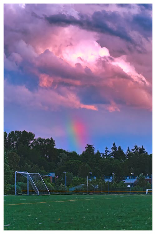 Photos gratuites de arc-en-ciel, foot, nuages dramatiques