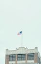 Us a Flag on Pole Near White Building