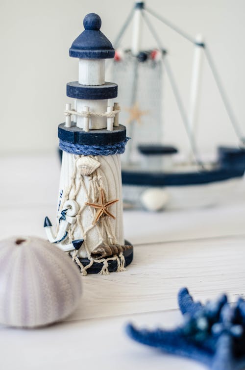 Wooden Lighthouse Toy on White Table
