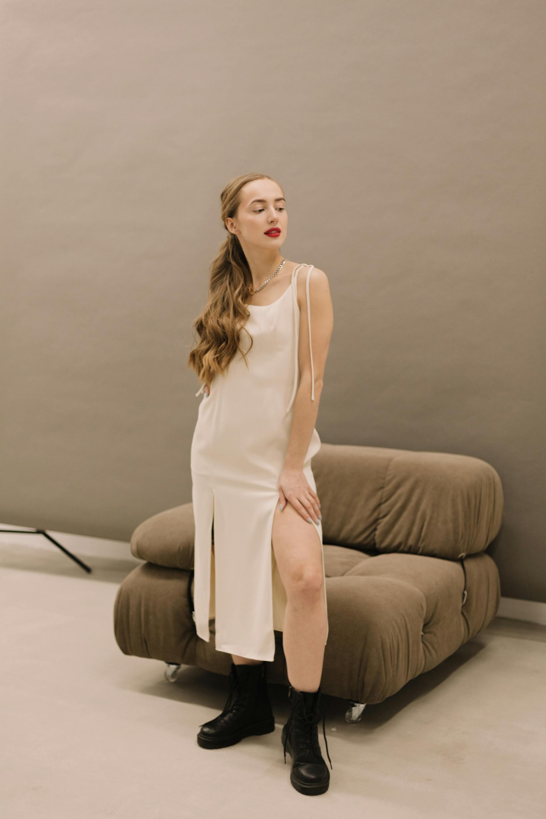 Woman Wearing White Dress and Black Boots  Free Stock Photo