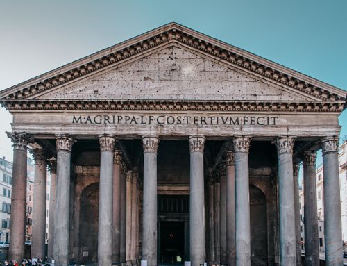 Free View of the historic Pantheon in Rome with its grand columns and ancient facade. Stock Photo
