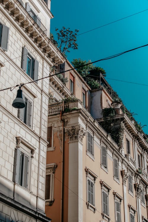 A Low Angle Shot of an Apartment Building Under the Blue Sky