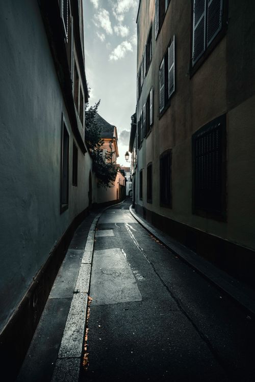 Free A narrow and atmospheric alley in Strasbourg, France, showcasing historic architecture. Stock Photo