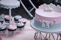 Pink and White Cupcake on Black Metal Stand