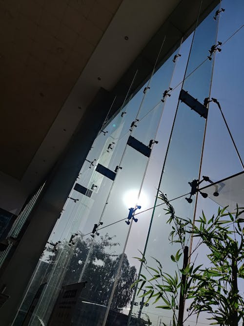 Free stock photo of architecture, bright sun, glass door
