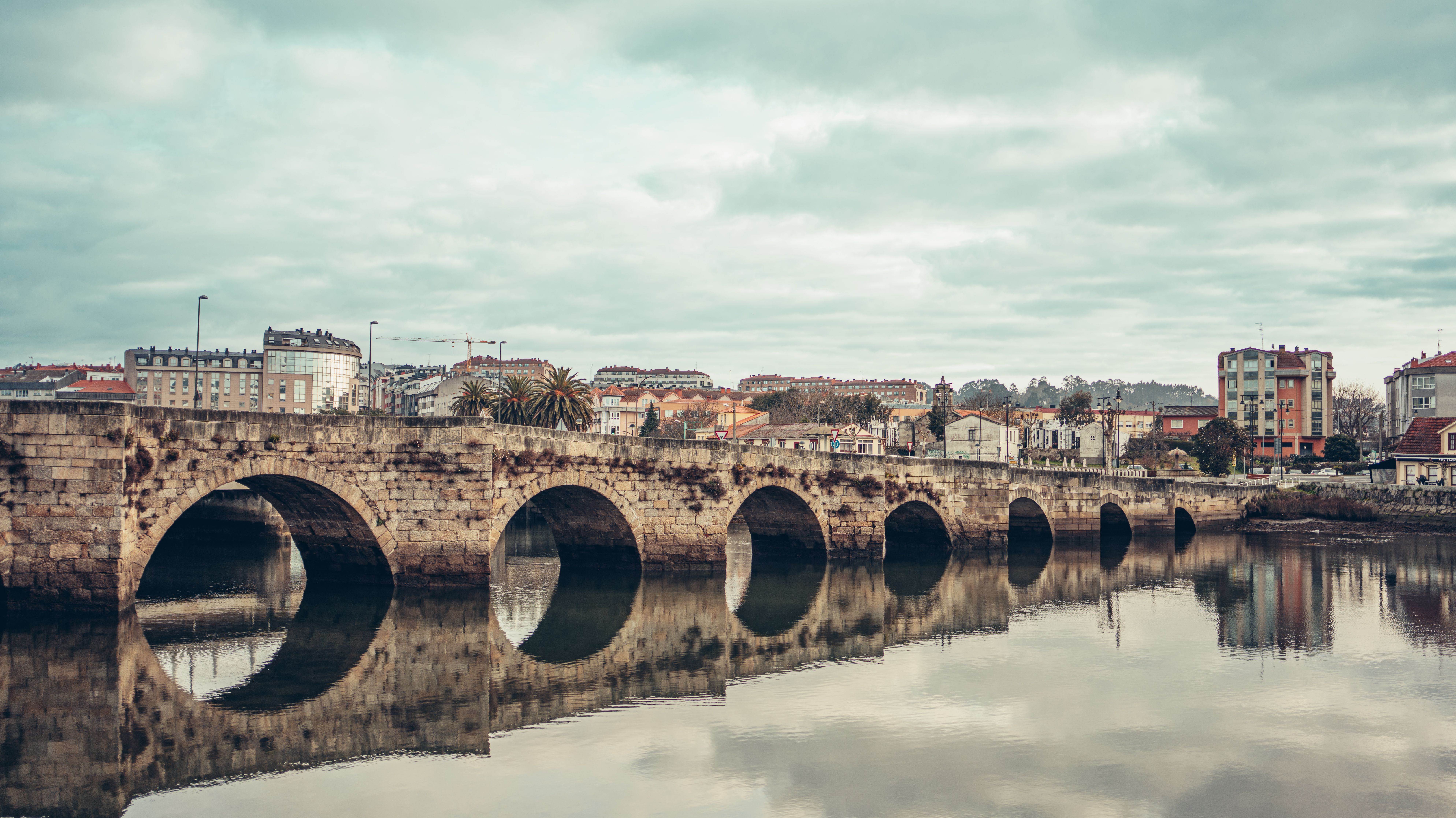 Scenic view of a historic stone bridge with reflections in Burgo, Spain. - Burgos