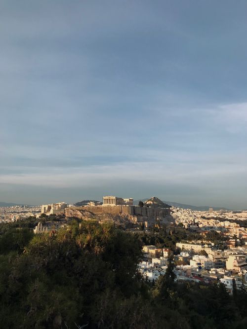 Free A stunning aerial view of the Acropolis in Athens, Greece, showcasing its historic beauty and urban surroundings. Stock Photo