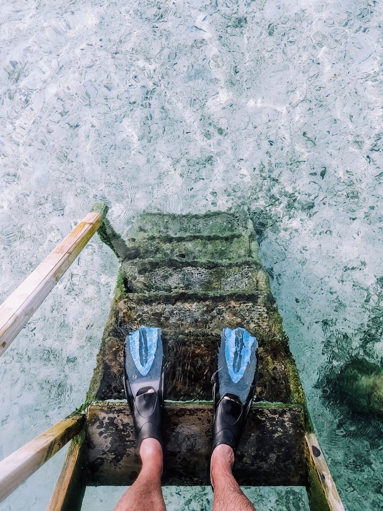 Man In Scuba Fins On Stairs