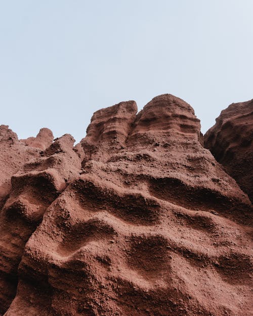 Brown Rock Formation Under White Sky