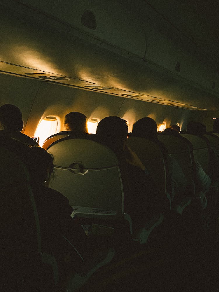 Passengers Sitting Inside An Airplane