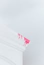 Pink Paint Stain on White Surface