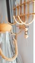 Brown Wooden Hanging Decor Near Clear Glass Bottle