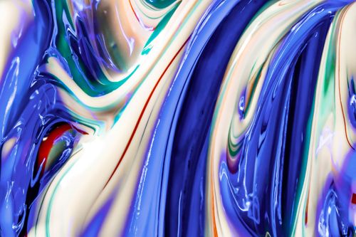 Free Close-up of colorful acrylic paint swirls creating a vibrant abstract pattern. Stock Photo