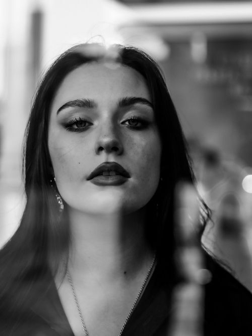 Free Captivating monochrome portrait of a woman with striking features and a pensive gaze. Stock Photo