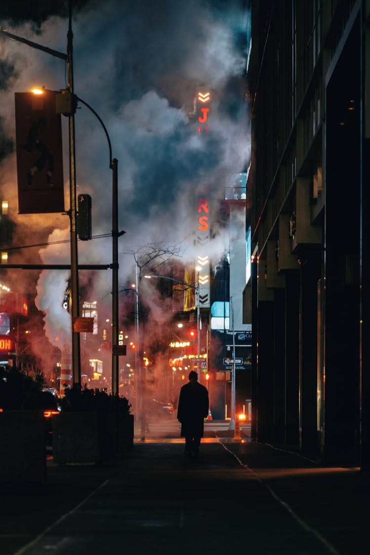 Male Silhouette In City Street By Night