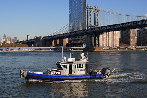 Free NYPD Motorboat Patrolling the East River Stock Photo