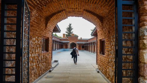 Free stock photo of architectural, architectural building, man walking Stock Photo