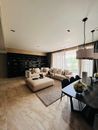 White Sectional Couch Beside Black Wooden Table