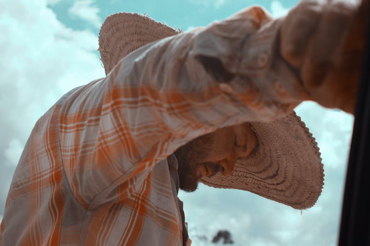 Arm Of Farmer With Hat