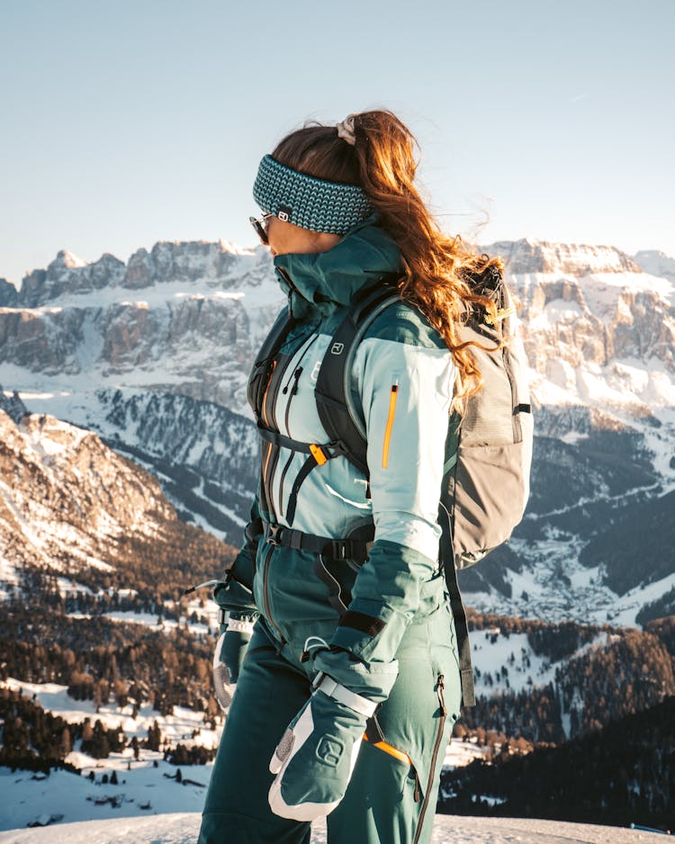 Woman Hiking In Mountains In Winter 