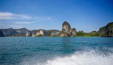 Green and Brown Island on Blue Sea Under Blue Sky
