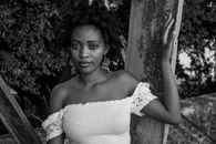Grayscale Photo of Woman in Off Shoulder Dress